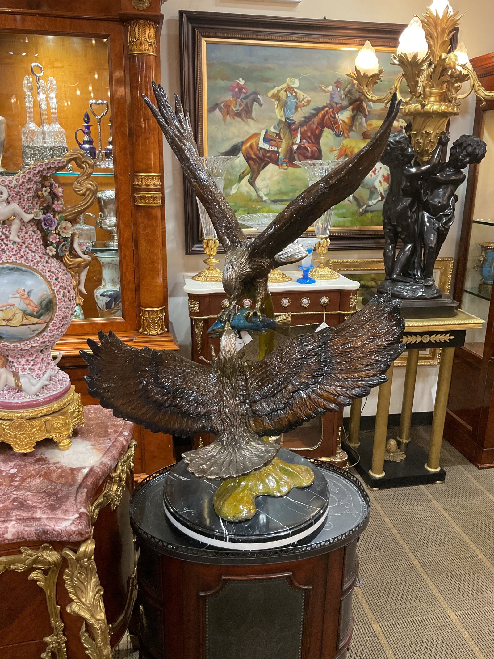 ER342 - Bronze Sculpture of Two Eagles in Flight: A powerful and dynamic bronze sculpture depicting two eagles engaged in mid-air, captured in a dramatic moment of motion and intensity. This striking composition highlights the strength, grace, and sy