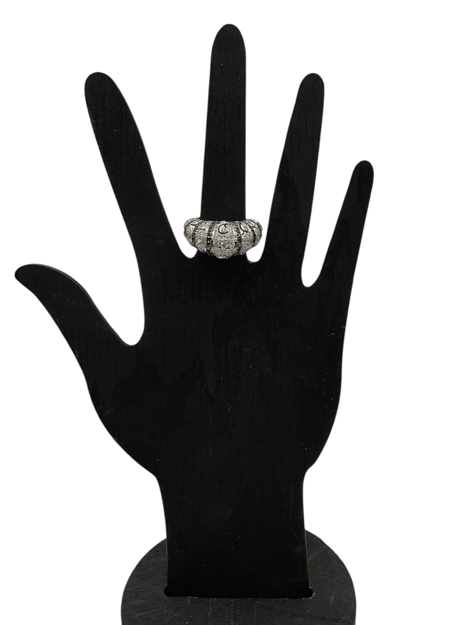 Black and White Diamond Ring: An elaborate black and white diamond ring featuring a bold segmented design with pavé-set diamonds and scrolling openwork accents. The contrasting black and white diamonds create dramatic visua