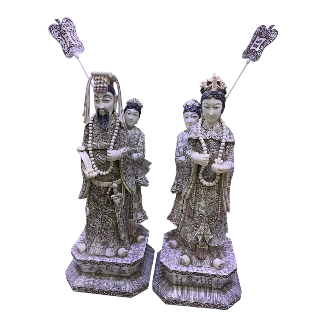 IC794 - Pair of Carved Asian Figures of Emperor and Empress: A finely executed pair of carved figures depicting an emperor and empress, presented in traditional ceremonial attire. These stately figures embody themes of authority, harmony, and imperial symbolism