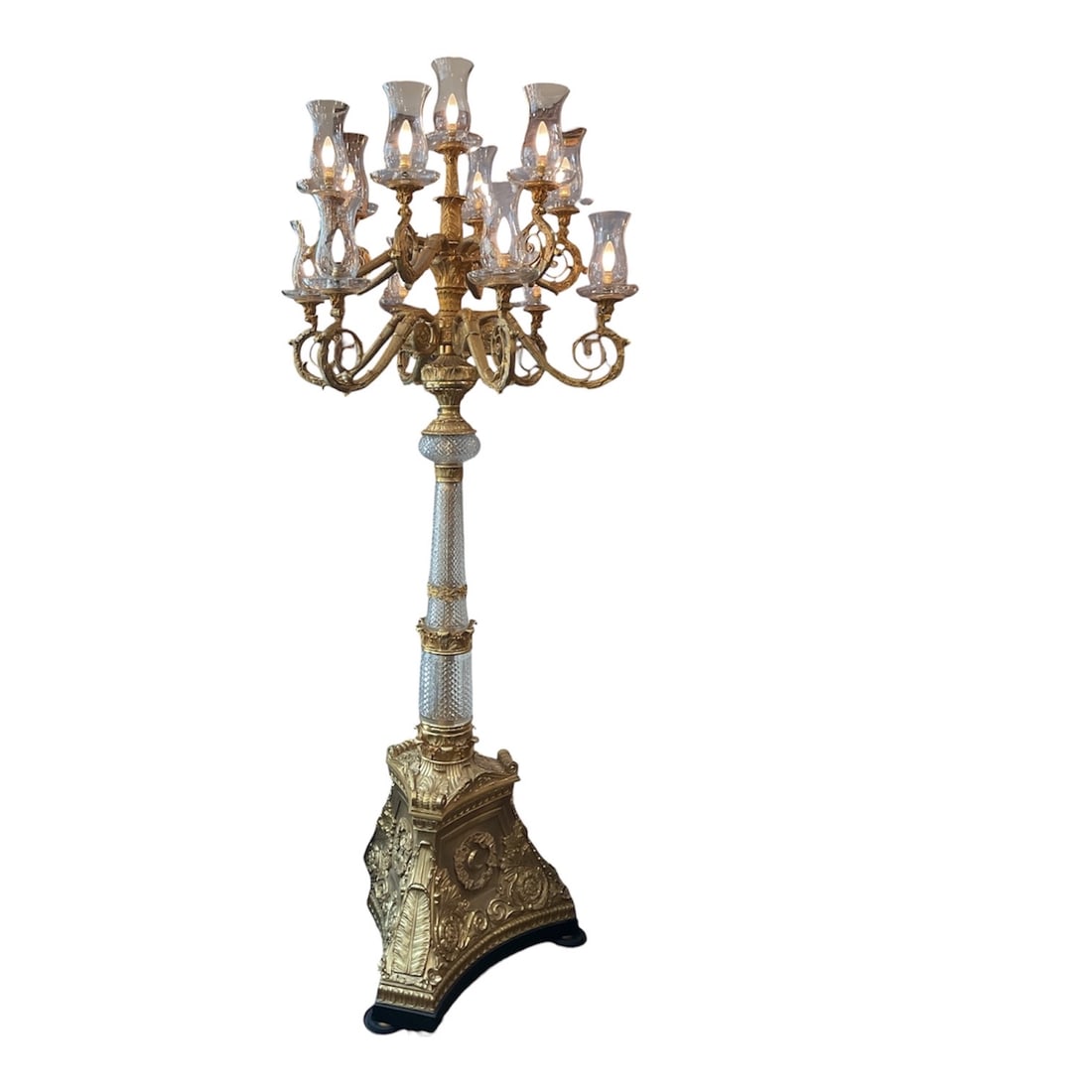 CS268 - Pair of Crystal and Dore Bronze Torchiers: An impressive pair of tall torchiers combining cut crystal elements with elaborate dore bronze mounts, designed in a grand classical style. These floor-standing lighting fixtures offer both functional