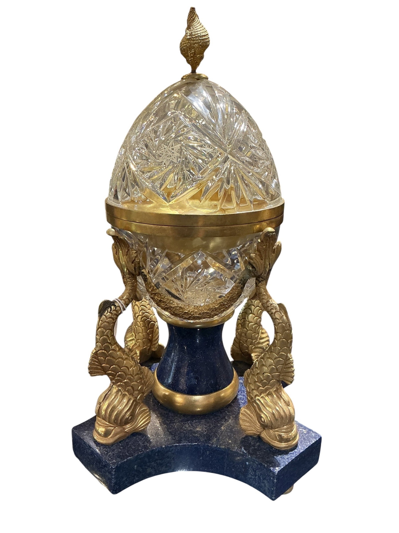 LC085 - Lapis, Crystal and Dore Bronze Egg Form Box: A striking decorative object featuring a cut crystal egg form mounted in dore bronze and raised on a lapis base, combining luxurious materials with sculptural design. The egg-sha