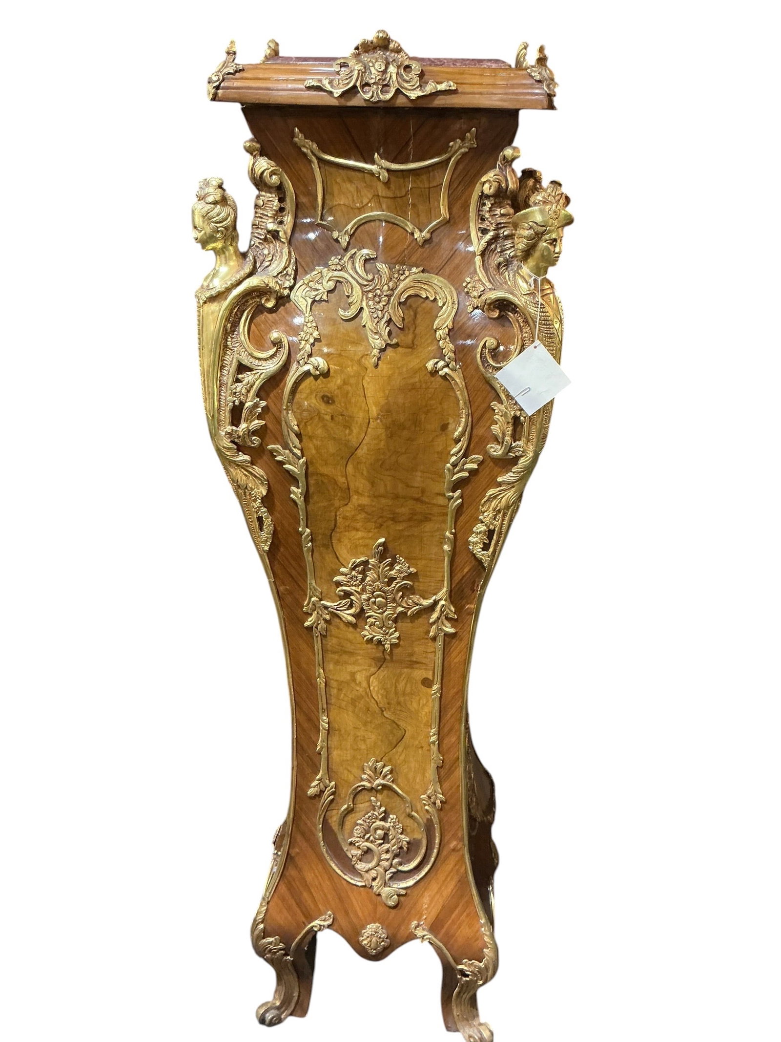 FR206 - Pair of Kingwood and Dore Bronze Pedestals - slight damage: An impressive pair of kingwood pedestals richly adorned with dore bronze mounts, executed in an opulent French style. Each pedestal features a gracefully shaped, serpentine form with bombe sides, show