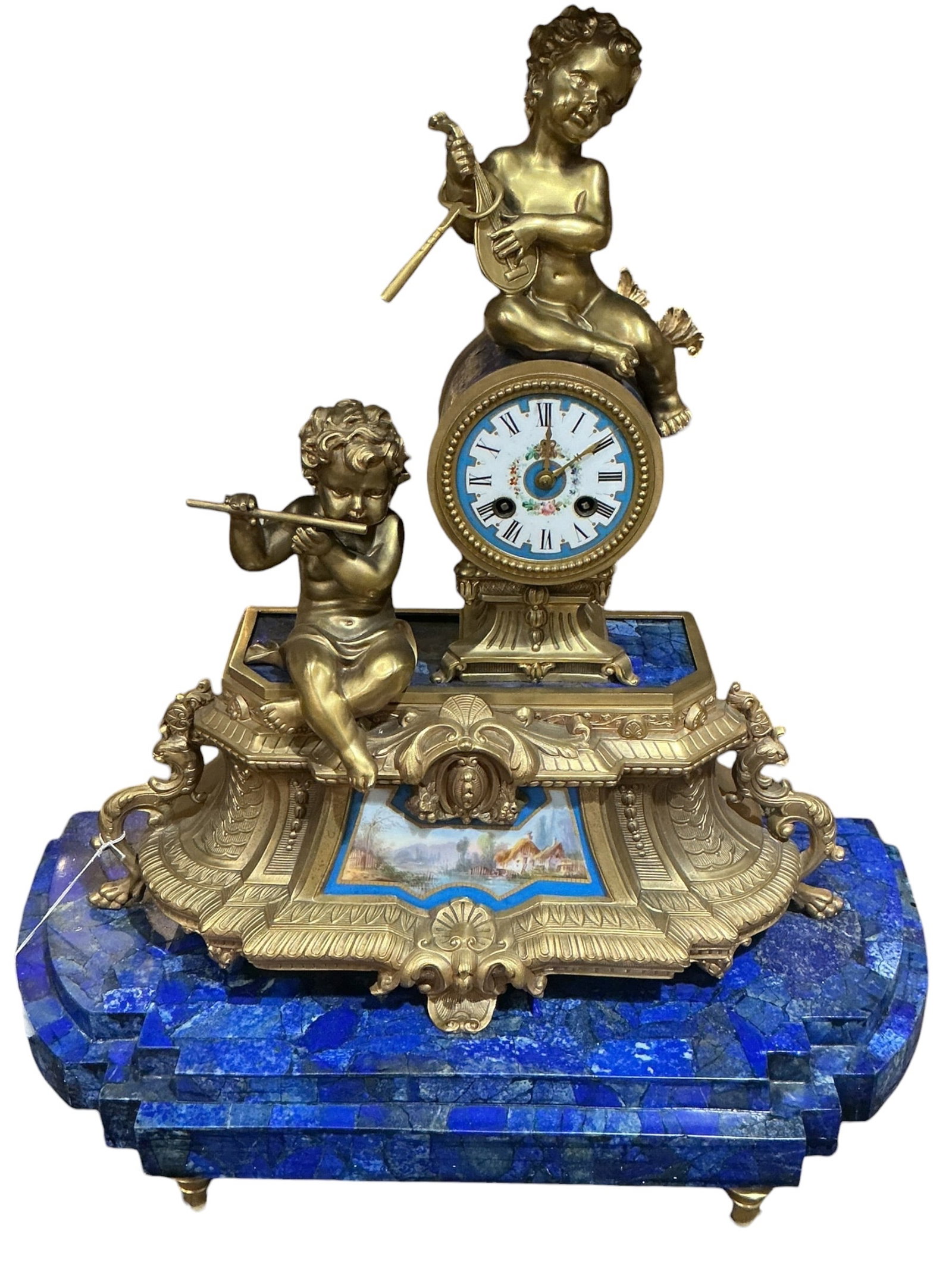 LC110- 19th Century French Sevres Style Clock with Lapis Base and Figural Bronze Mounts: A richly decorative 19th century French clock