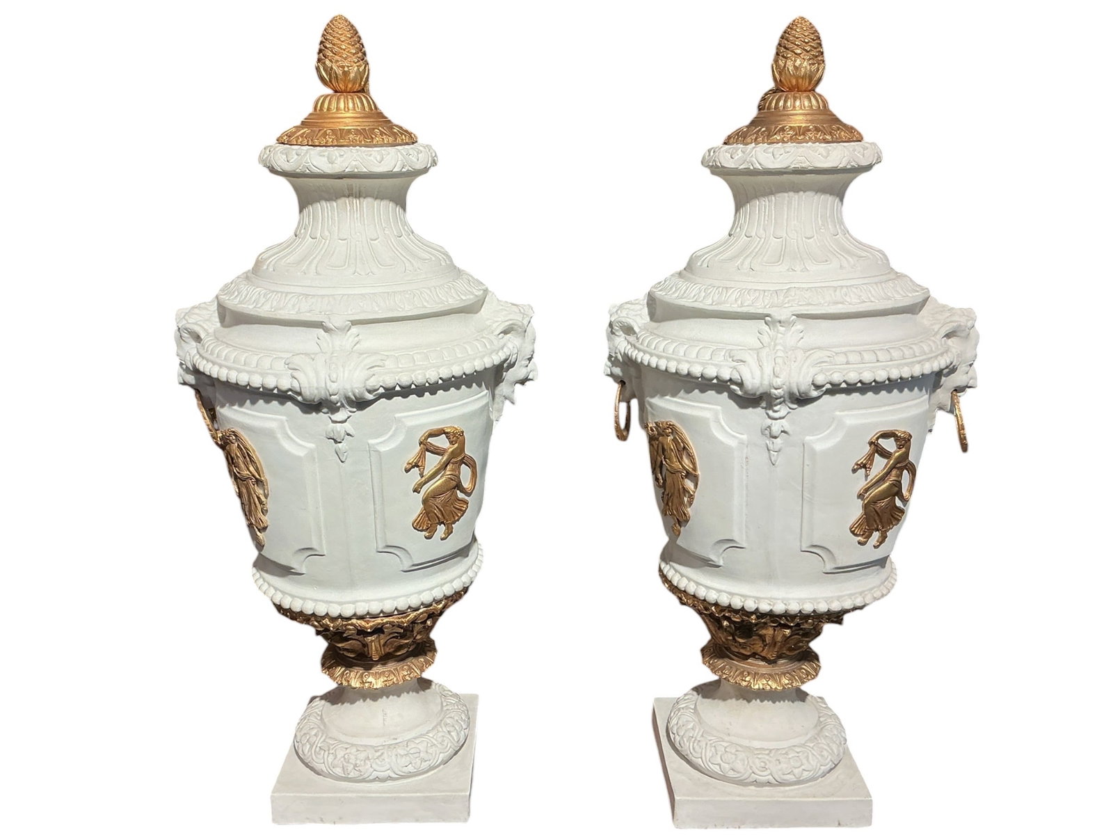 PC622 -Pair of 19th Century Bisque Porcelain and Dore Bronze Mounted Vases: A refined pair of 19th century bisque porcelain vases accented with dore bronze mounts, executed in a neoclassical style. Each vase is formed with a covered urn shape, featuring a softly matte bisque 