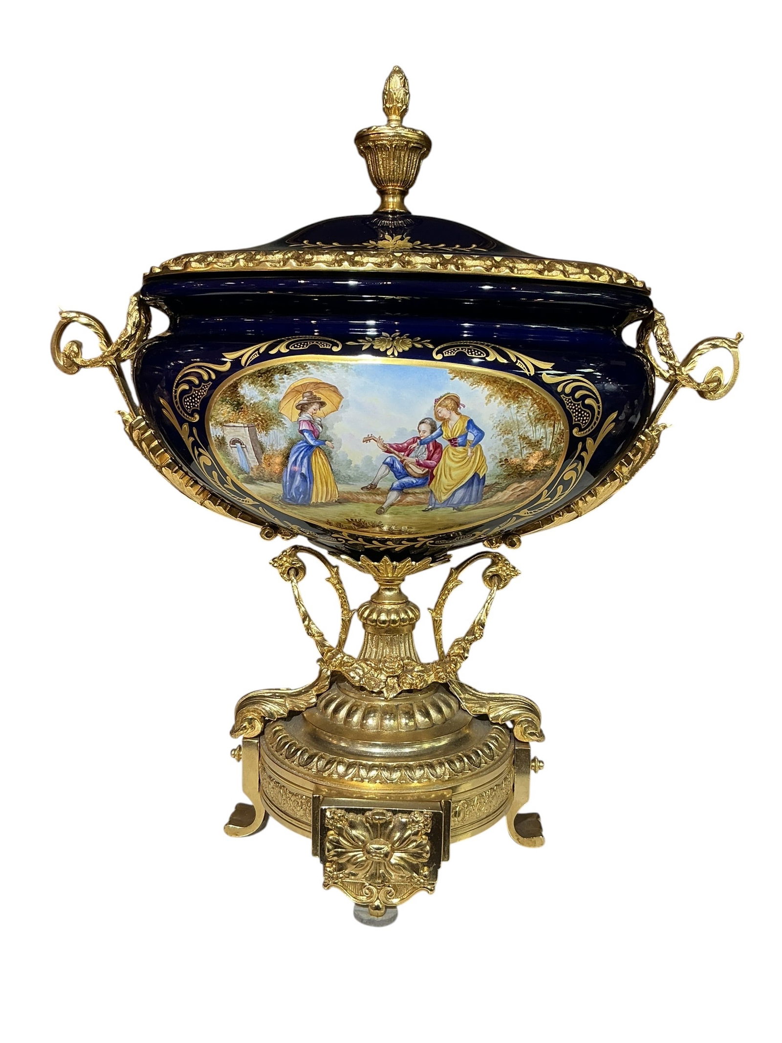 PC536 - Cobalt Blue Hand-Painted Porcelain Center Bowl with Dore Bronze Mounts: An exceptional center bowl crafted in deep cobalt blue porcelain and richly adorned with dore bronze mounts, executed in an elegant European style. The bowl features a rounded form with a fitted lid, 