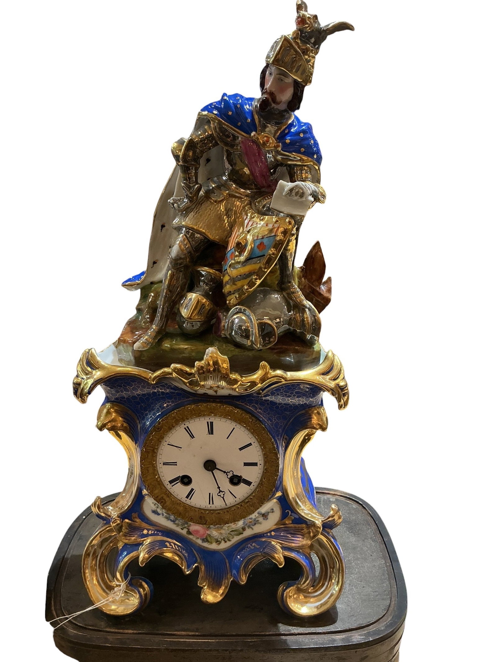 AQ053- 19th Century Jaco Petit Porcelain Figural Clock with Knight on Horse: A rare and finely executed 19th century porcelain clock attributed to Jaco Petit, featuring a dramatic figural composition of a knight mounted on horseback. The scene is richly detailed, with the knig
