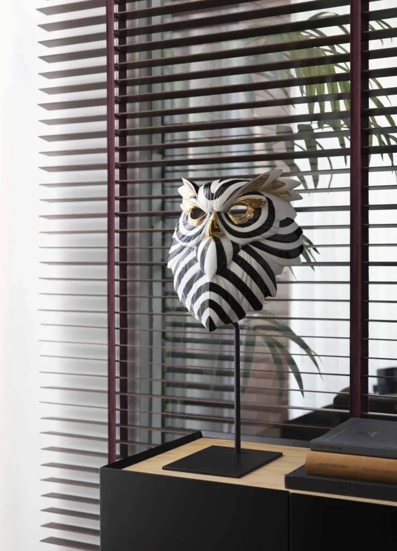 Lladro Owl Mask. Black and Gold: Inspired by traditional African masks, this porcelain collection showcases a bold contemporary aesthetic with striking decorative appeal. The series features three distinct animal-inspired designs