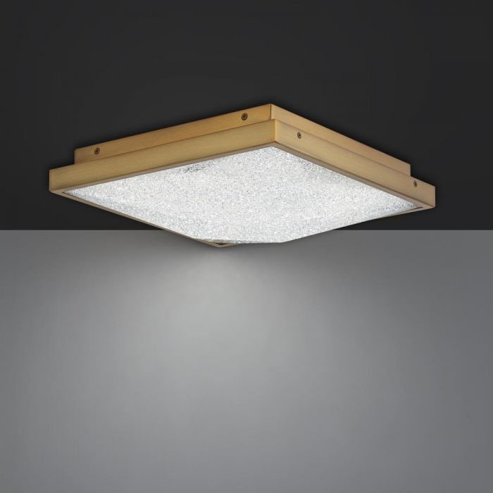 Schonbek Beyond Wisteria 12" LED Flush Mount: A true statement piece, the Wisteria flush mount ceiling light dazzles with its inverted pyramid silhouette and radiant sparkle. Nestled within a polished metal frame, Optic Crystal and a Radiance Cry