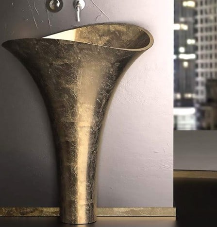 Maestro Bath Gold Leaf Sink: A bold expression of sculptural luxury, this Maestro Bath gold leaf sink transforms the everyday ritual of bathing into an artistic experience. Inspired by the graceful form of a blooming calla lily,