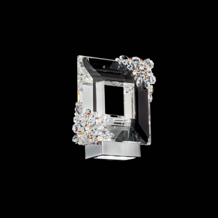 FOREVER SCHONBEK EVA SCONCE: As light strikes its elegant design, the Eva wall sconce's Radiance Crystal glows with color, encased in Swarovski pearls and wrapped in a silky connection. 12''W x 5''D x 13''H