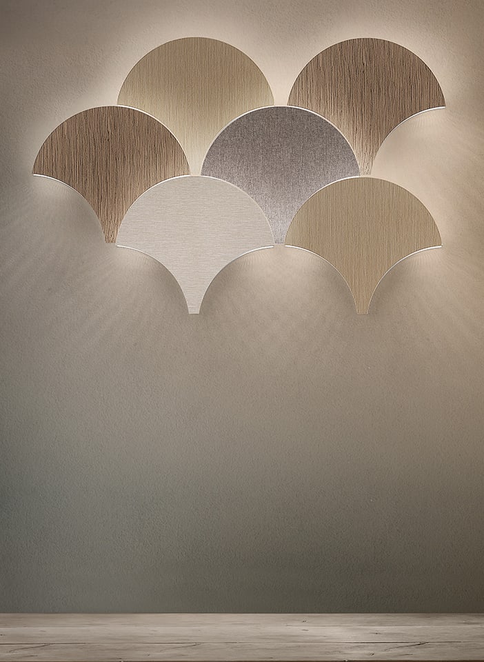 Masiero Dimore Palm A40 Wall Sconce: The Masiero Palm Wall Sconces are a poetic fusion of lighting and wall sculpture â€” an elegant composition inspired by the graceful movement of palm leaves and organic forms. Designed as