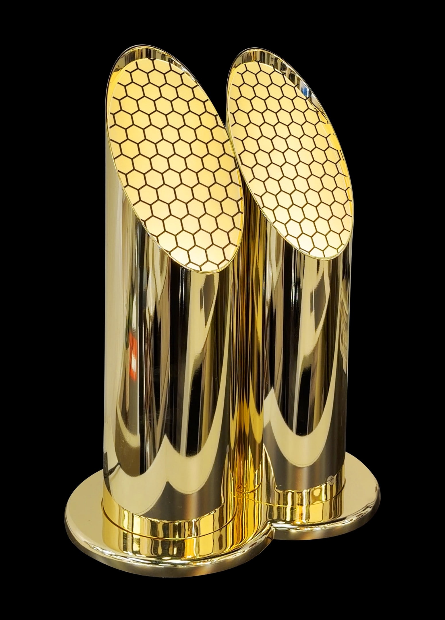 Tonino Lamborghini Casa Daytona Table Lamp: A captivating fusion of modern artistry and refined glamour, this table lamp commands attention with its sculptural dual-column silhouette and radiant metallic finish. Its polished gold-toned body
