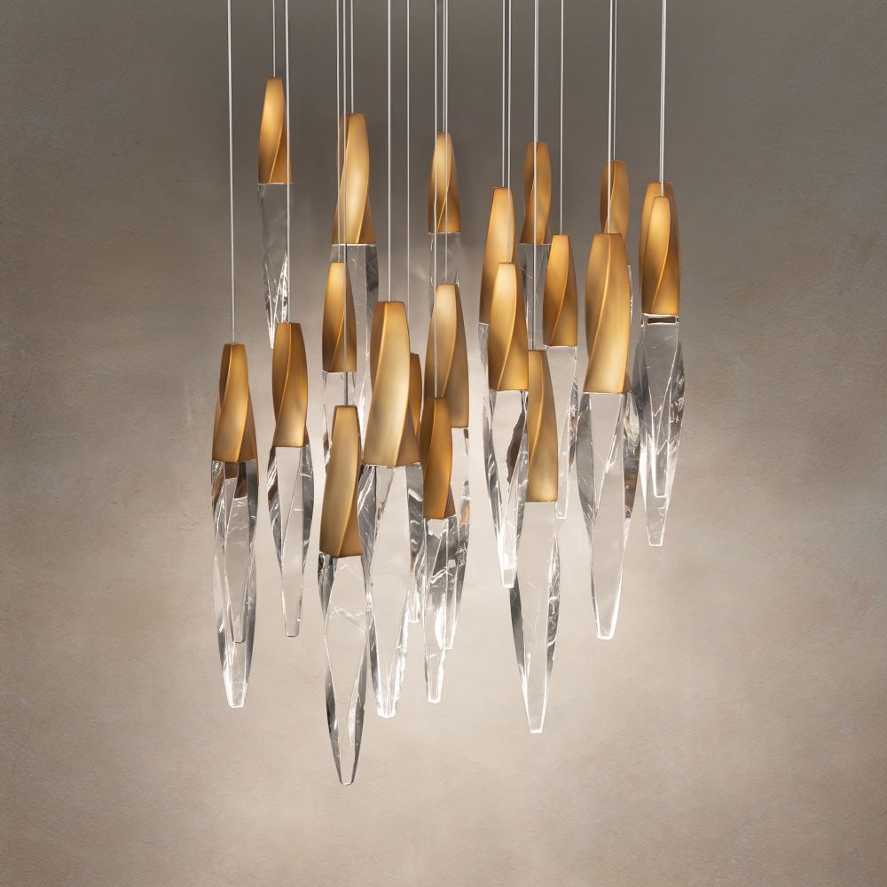 Kindjal 21 Lights Chandelier in Aged Brass and Clear Optic Crystal: This Kindjal Pendant includes luxurious twisted icicle crystals portruding from cohesive and elegant metal fittings which conceals the LED, providing stylish illumination for adequate downlighting. Ma