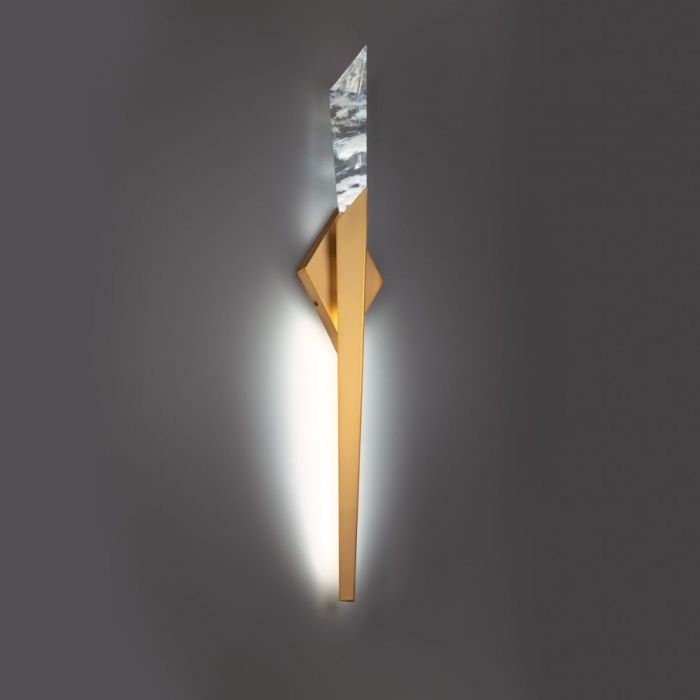 Schonbek Beyond Solitude 32'' Brass Wall Sconce: A Solitude Wall Sconce is a dramatic character that you cant help but love. This piece features haze crystal composed of natural quartz gemstone, illuminating and gravitating. Spears of crystal jut ou