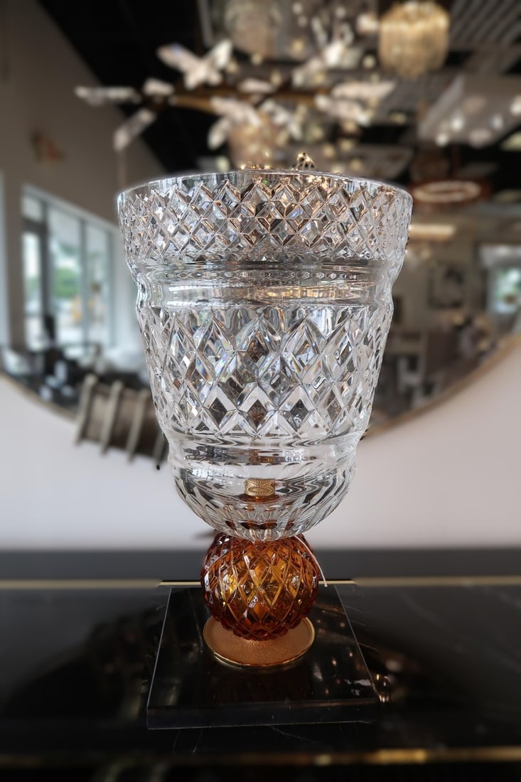 Mariner 14250 Decorative vase with Black Marquina Base: The Mariner Decorative Vase is a striking expression of refined luxury and artisanal craftsmanship. Expertly formed from brilliantly cut crystal, the vase showcases an intricate diamond-pattern design