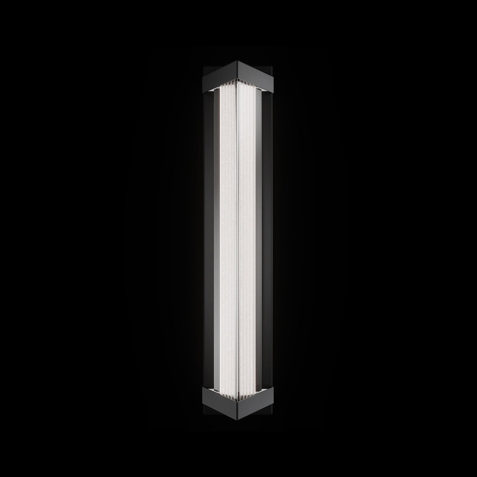 Bertram Outdoor Wall Sconce: Bertram redefines outdoor lighting with a bold triangular silhouette that surrounds a radiant column of saw-cut Optic Crystal. Its precisely cut facets diffuse light with a brilliant, shimmering effec