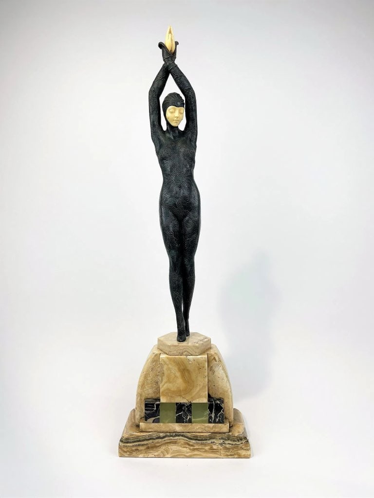 Starfish by D. H. Chiparus (Romania/France, 1886–1947) Art Deco Style Bronze on Marble Base: DescriptionArt Deco style sculpture depicting a standing female figure with arms raised above her head, mounted on a stepped mar