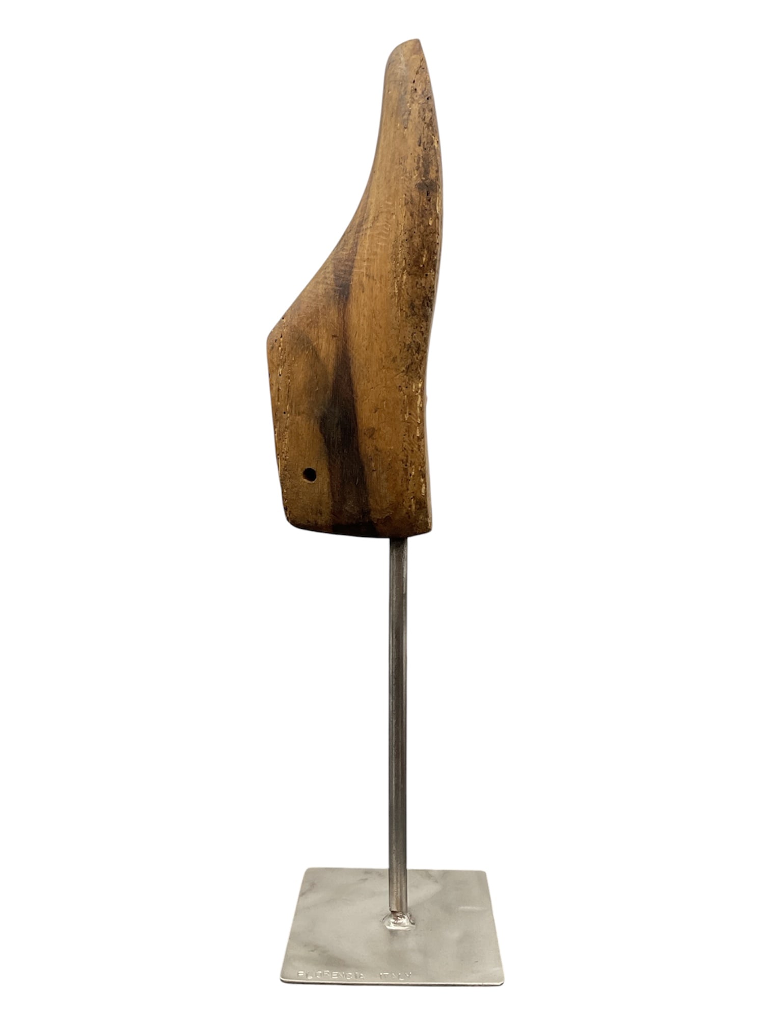 Vintage Italian Wooden Cobbler’s Shoe Last Sculpture on Stand: Vintage carved wooden cobbler’s shoe last mounted on a brushed metal display stand stamped “Florencia Italy.” The elongated form features rich natural wood grain, warm patina, and vi
