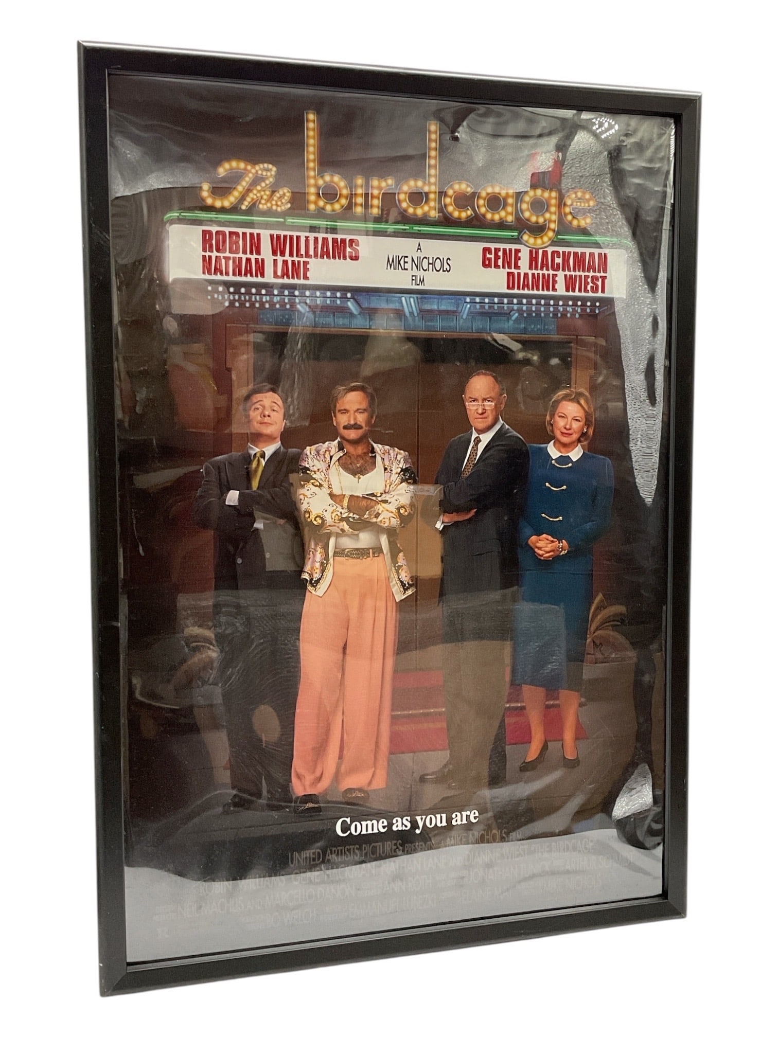 "The Birdcage" Original One-Sheet Movie Poster by Mike Nichols (American, 1931-2014) Offset: This original one-sheet movie poster promotes the 1996 comedy classic The Birdcage, directed by Mike Nichols. The iconic imagery features the primary cast—Nathan Lane, Robin Williams, Gene