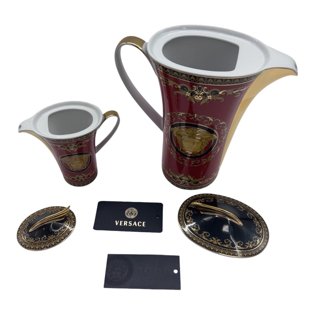 A magnificent Versace Rosenthal Medusa creamer set (2pc): A magnificent Versace Rosenthal Medusa creamer set, featuring one large and one small creamer, exemplifying the iconic collaboration between the esteemed German porcelain maker Rosenthal and the