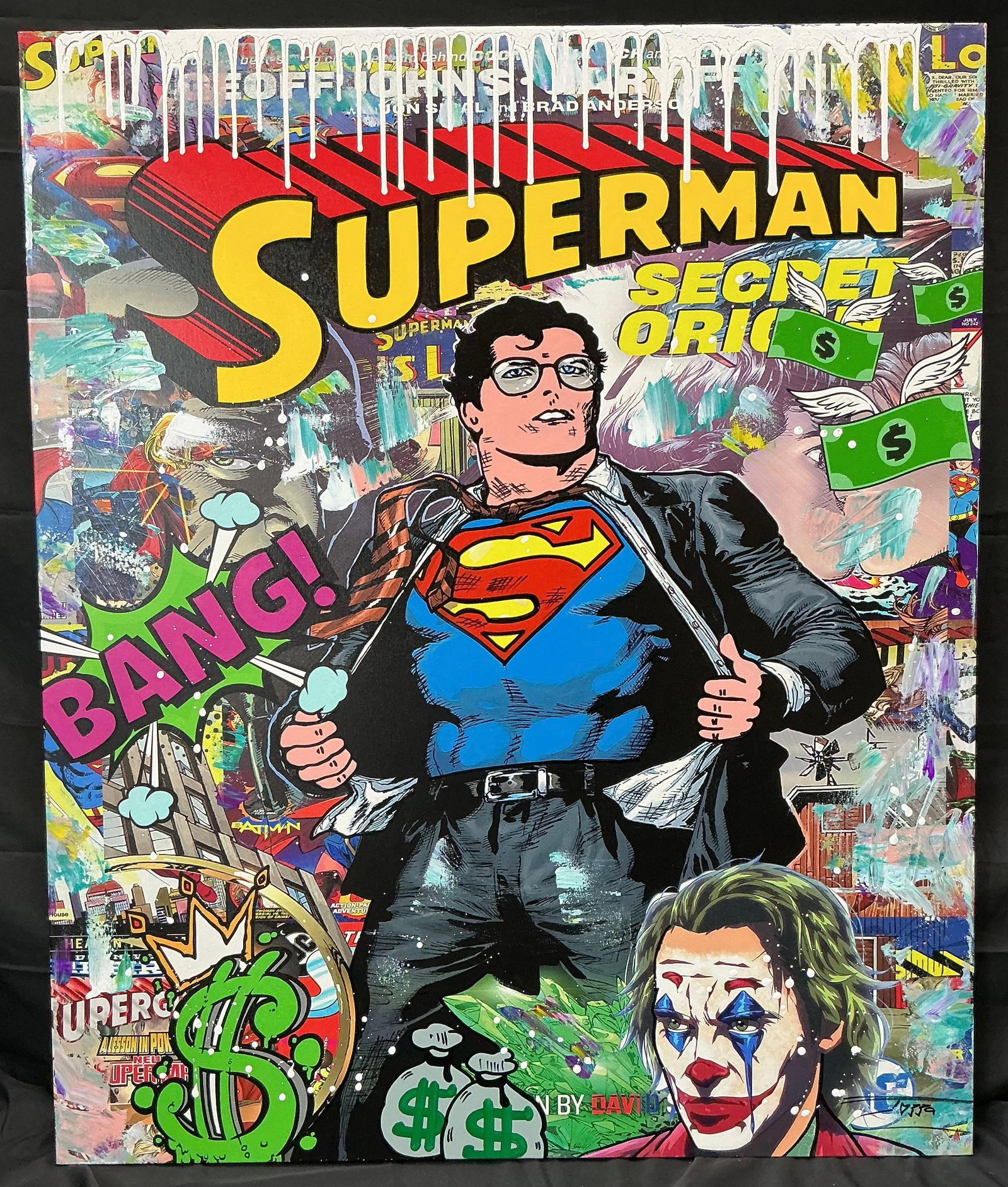 Superman Secret Origins Pop Art by Jozza: Bold and colorful pop art painting by Jozza featuring Superman revealing his identity, with comic-style elements like "BANG", dollar signs, and the Joker. The background includes vibran