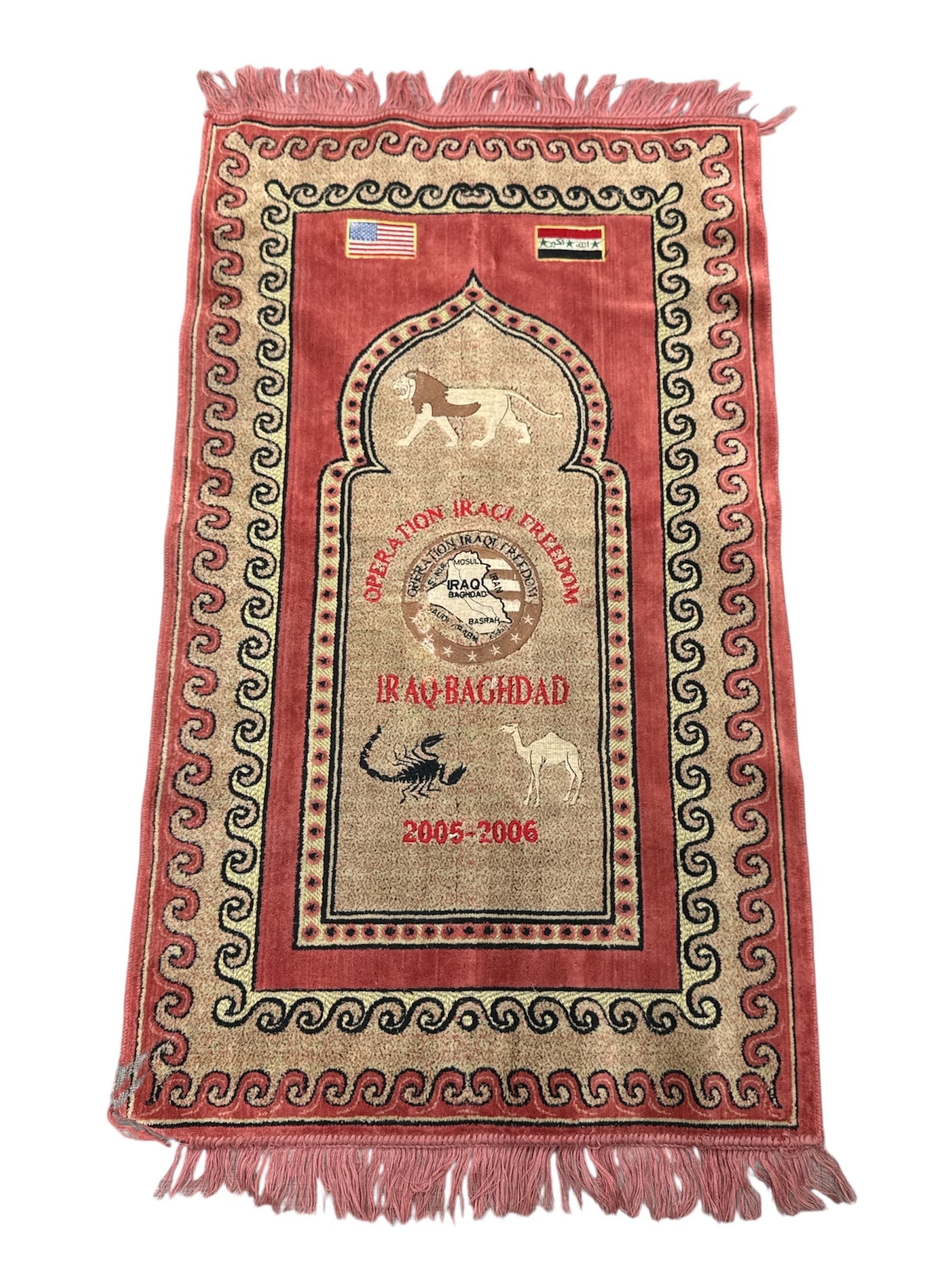 Operation Iraqi Freedom Iraq–Baghdad Commemorative Textile Rug 2005–2006: Commemorative textile rug produced in connection with Operation Iraqi Freedom, featuring bold graphic imagery and symbolic motifs. The central arch design incorporates animal figures, scorpion