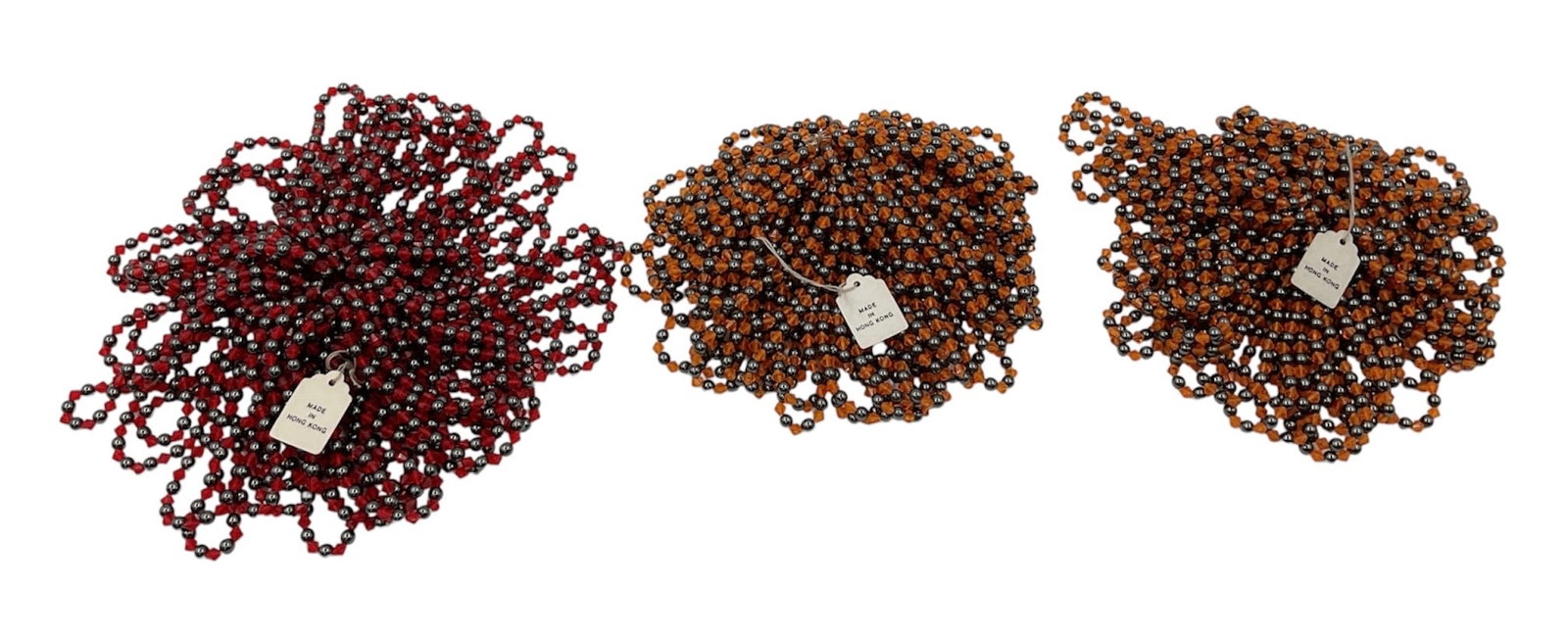 Group of Swarovski Crystal Beaded Strands: Group of Swarovski crystal beaded strands featuring faceted crystal beads in rich burgundy, bronze, and amber tones. The strands display sparkling multi-strand arrangements with signature Swarovski br