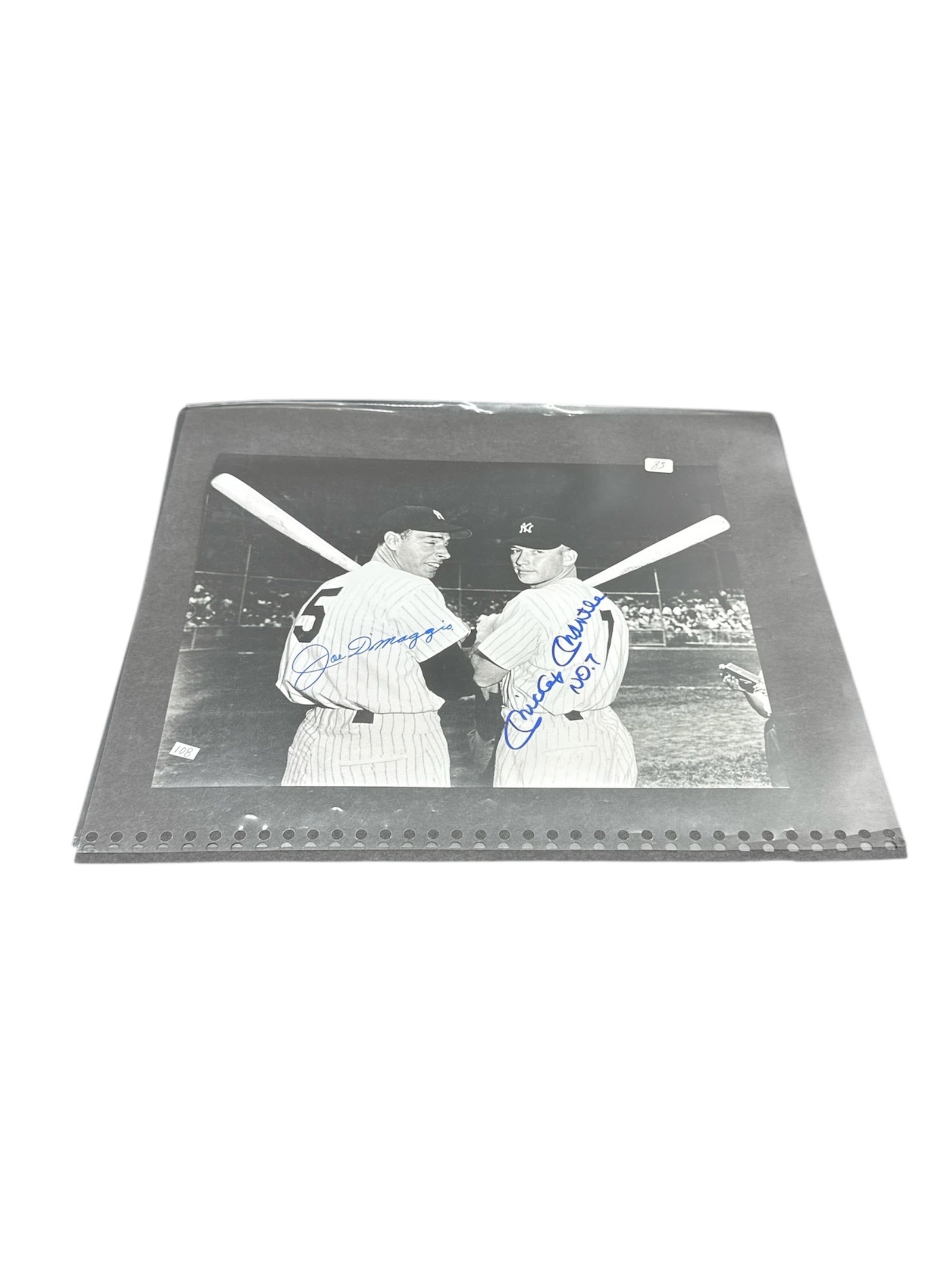 RARE Joe DiMaggio and Mickey Mantle Dual Signed New York Yankees Photograph: This large black-and-white photograph features two of the greatest figures in New York Yankees history, Joe DiMaggio and Mickey Mantle, posed together on the field in uniform with crossed bats behind 