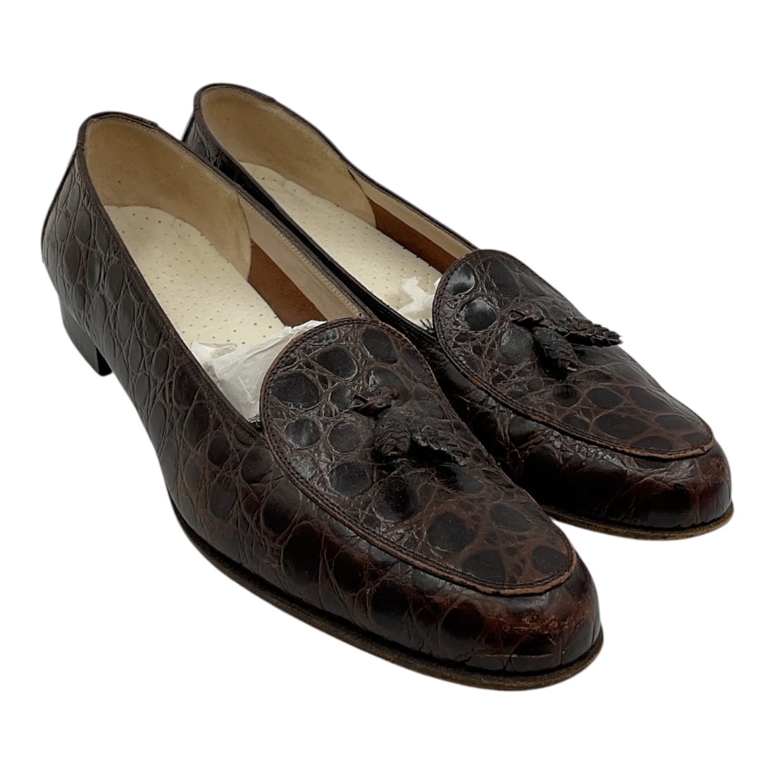 Salvatore Ferragamo Brown Croc Embossed Tassel Loafers Size 7.5: Pair of Salvatore Ferragamo loafers crafted in brown croc embossed leather featuring tassel accents across the vamps and classic low heel silhouette. Slip-on design with refined Italian designer styli