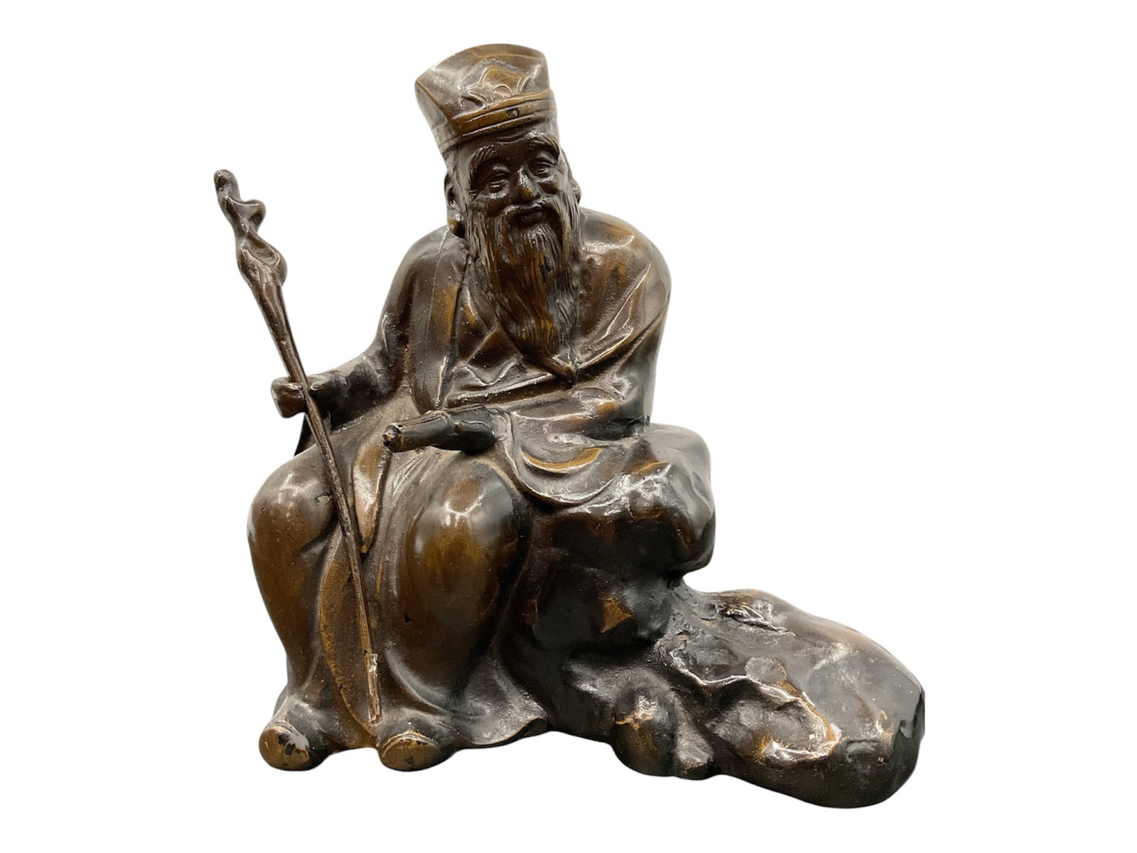 Chinese Bronze Figure of Scholar or Immortal: Decorative bronze sculpture depicting a seated Chinese scholar or immortal figure holding a staff and scroll while resting atop a rocky naturalistic base. The figure wears flowing robes and a traditio