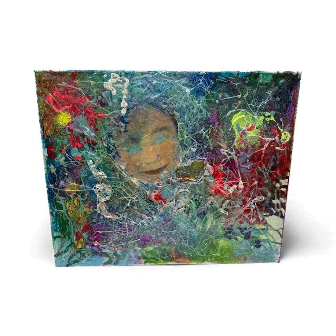 Pingo Hidden Portrait: A vivid abstract composition layered with energetic splatters, swirling textures, and bold color fields in blues, reds, and greens. At the center, a subtly emerging face appears through the dense surf
