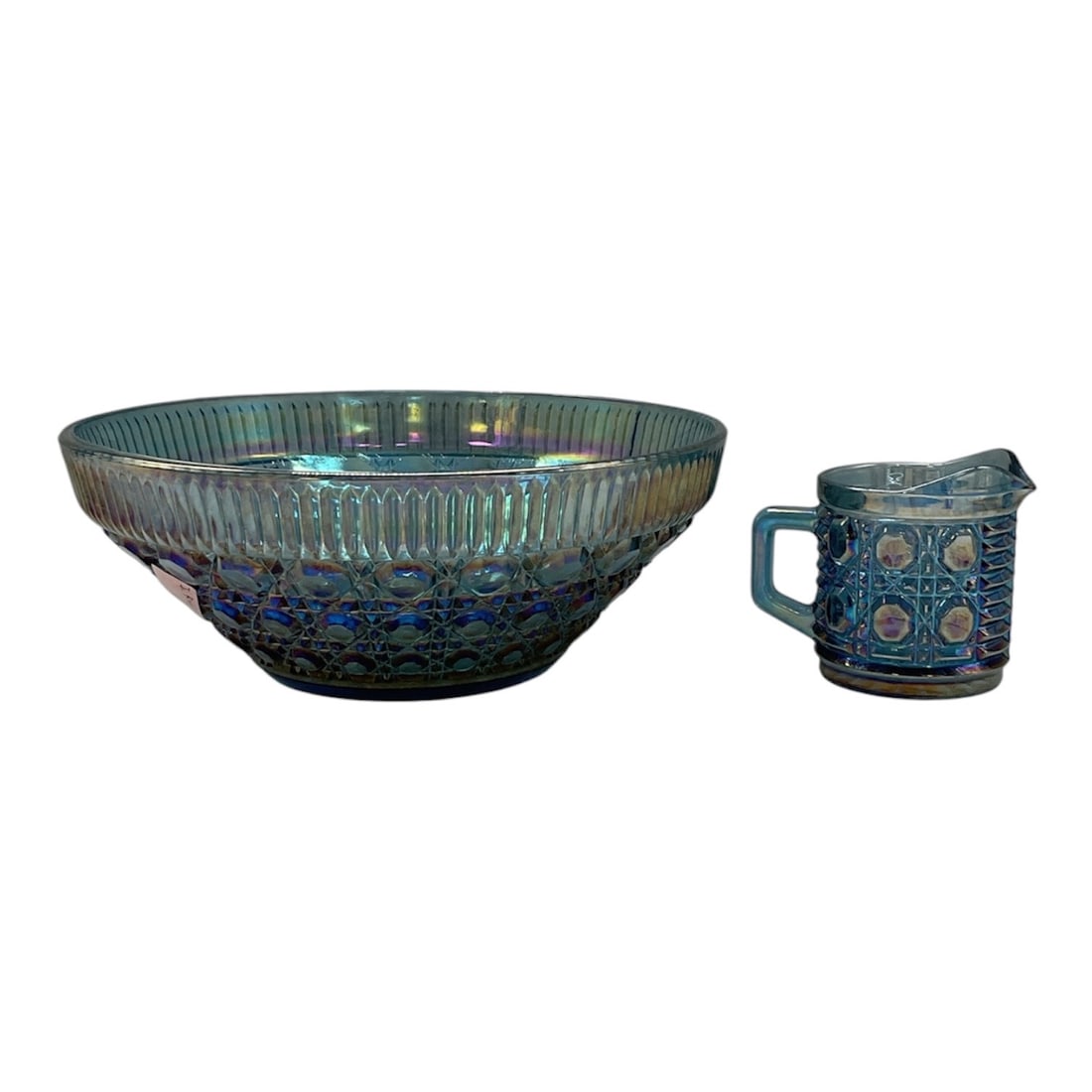 Collection of Indiana Windsor Blue Carnival Glass: Collection of vintage Indiana Glass Windsor Blue carnival glass items featuring the classic “Button and Cane” pattern. The group includes a large iridescent bowl and matching creamer with