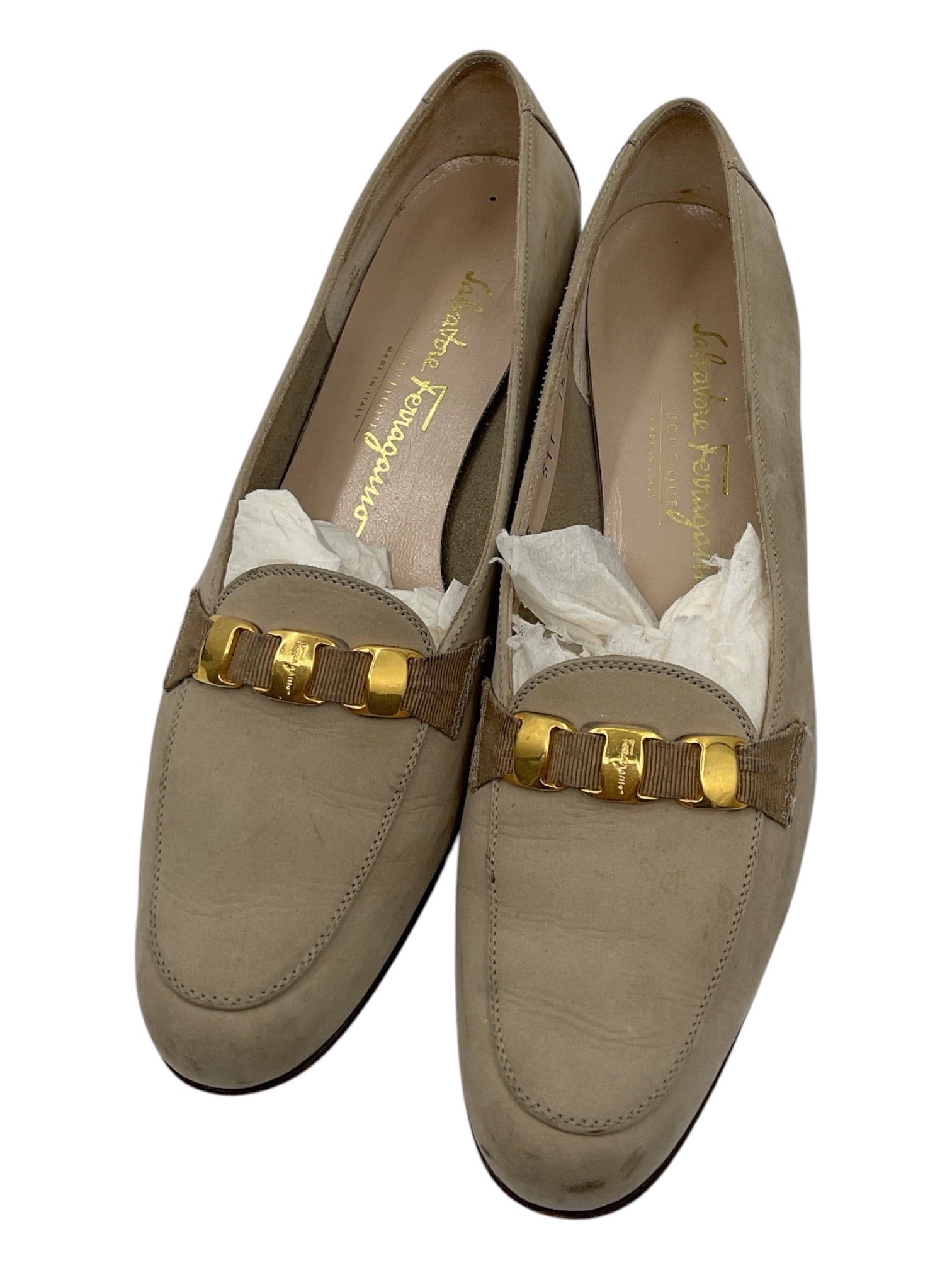 Salvatore Ferragamo Beige Suede Loafers Size 7.5: Pair of Salvatore Ferragamo women’s loafers crafted in beige suede featuring signature gold-tone Gancini hardware across the vamp. Classic slip-on silhouette with leather interiors and