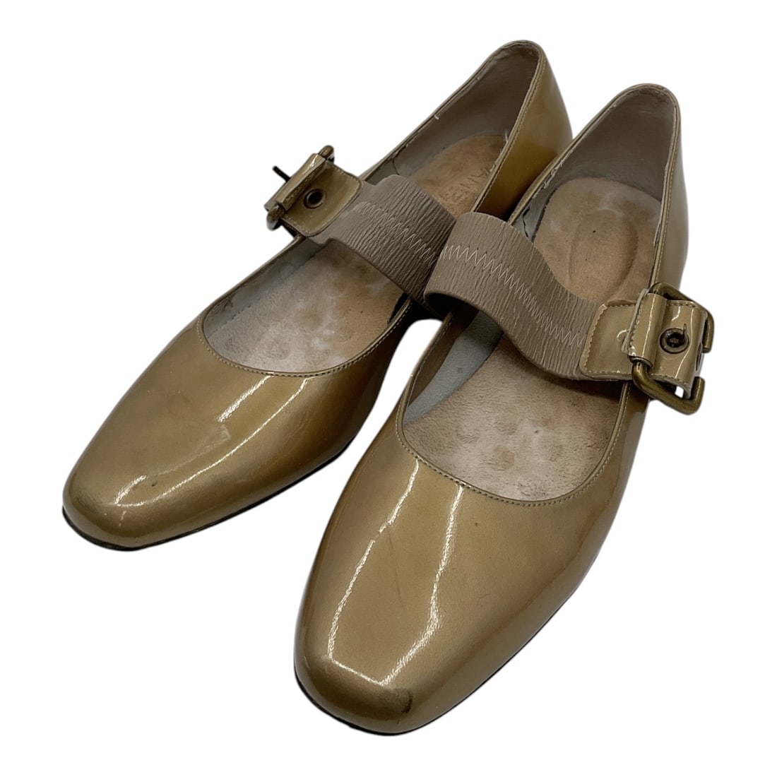 Salvatore Ferragamo Beige Patent Leather Mary Jane Shoes Size 7.5: Pair of Salvatore Ferragamo women’s shoes crafted in beige patent leather featuring square toes and adjustable Mary Jane style straps with gold-tone buckle hardware. Elegant low-profile