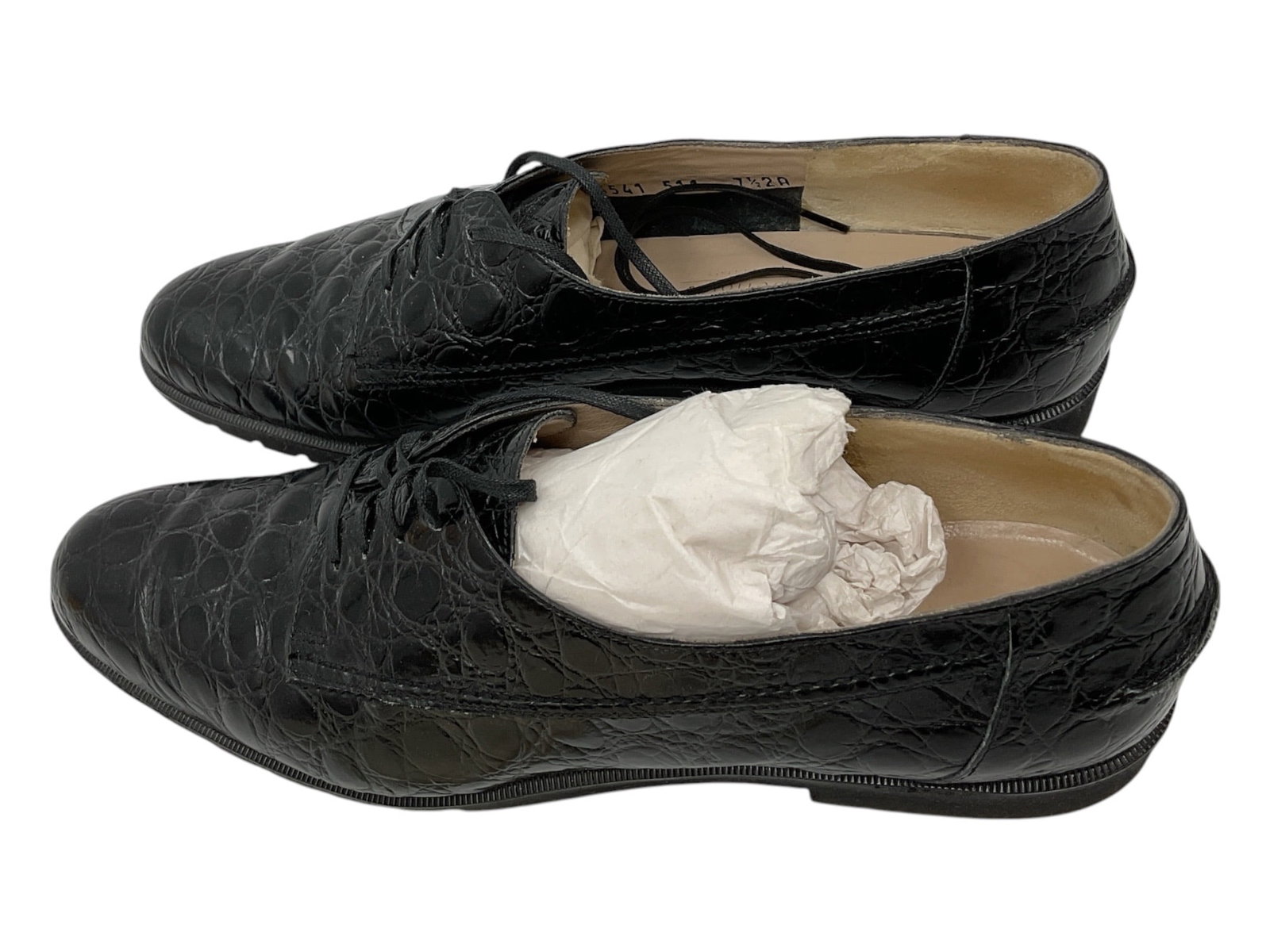 Salvatore Ferragamo Black Ostrich Leather Oxford Shoes Size 7.5: Pair of Salvatore Ferragamo lace-up oxford shoes crafted in black ostrich leather with textured exotic skin patterning and classic low-profile silhouette. Features leather interiors and refined