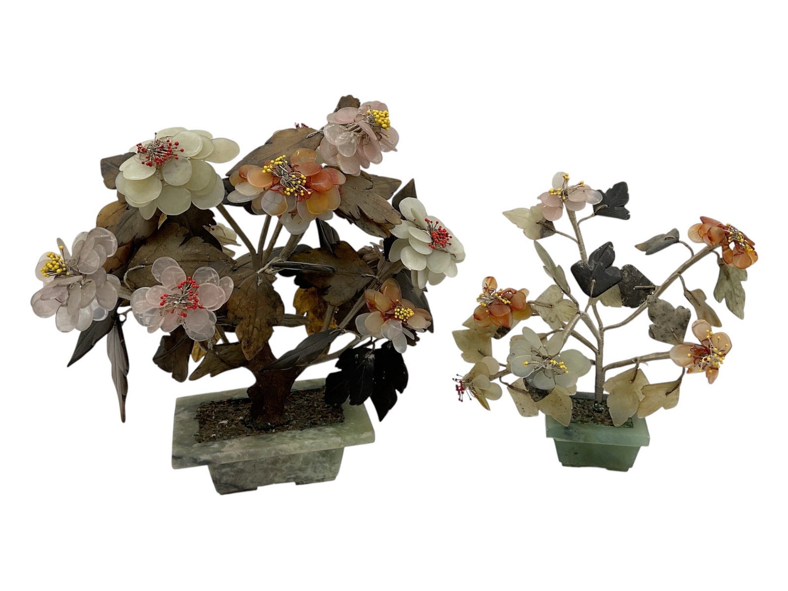 Pair of Hardstone Flowering Bonsai Sculptures: Decorative pair of hardstone flowering bonsai sculptures featuring carved stone blossoms and leaves mounted on wire branches with stone bases. Includes two floral arrangements in varying forms and