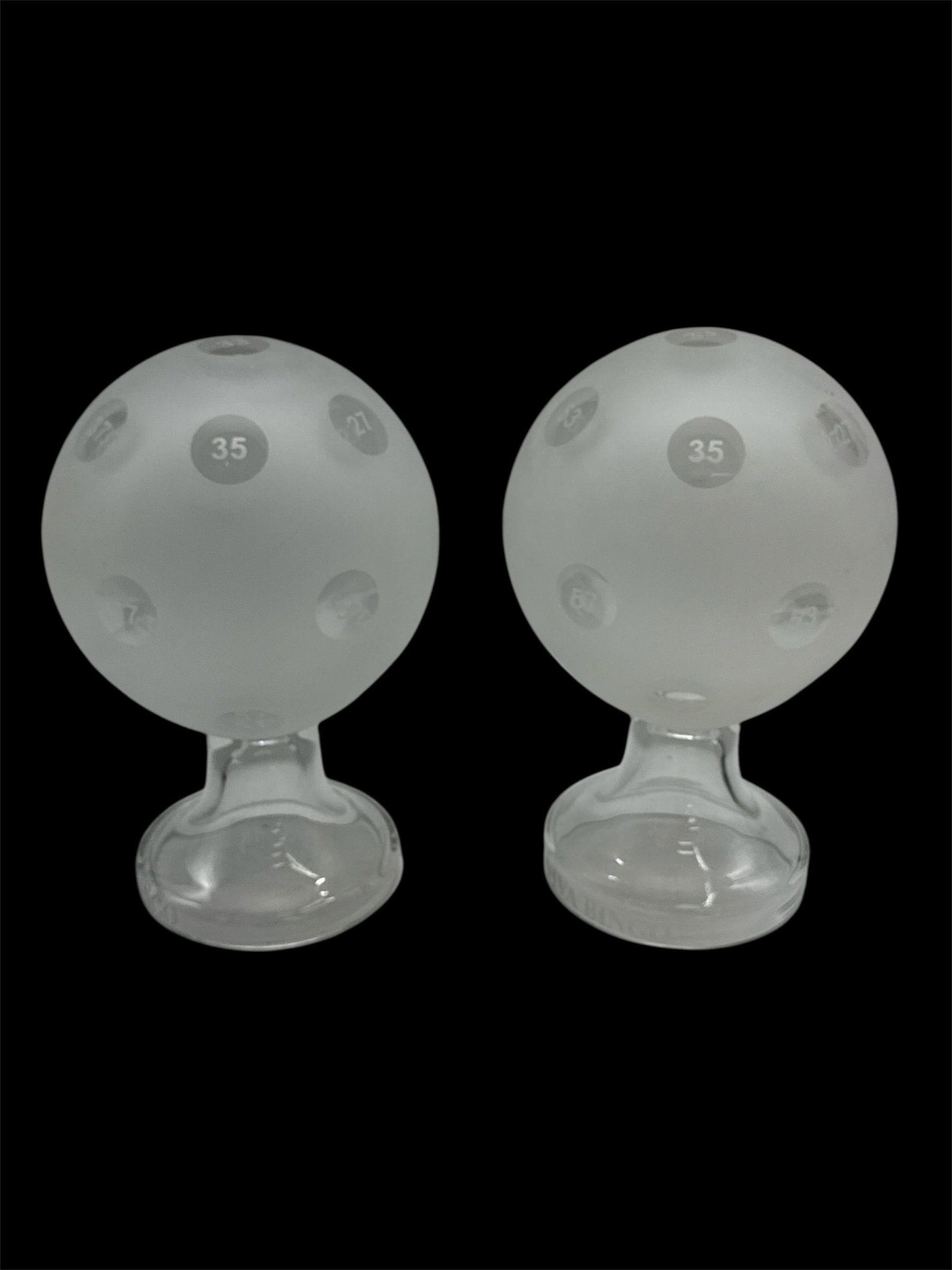 Pair of Viva Bingo Frosted Glass Trophy Displays: A pair of frosted glass trophy-style display pieces featuring spherical tops etched with the number 35 and mounted on pedestal bases engraved Viva Bingo. Each example is crafted in thick molded glass 