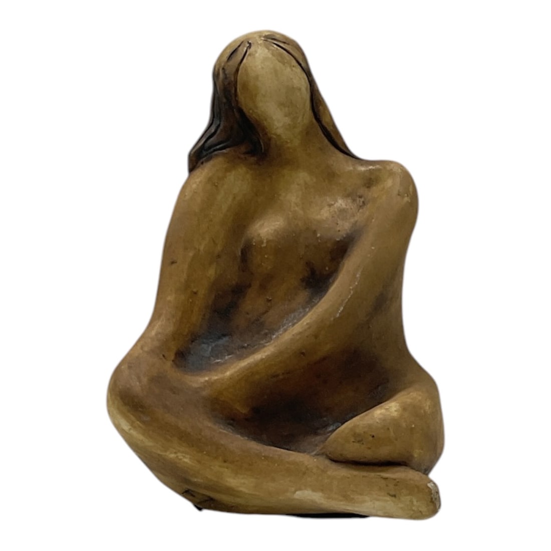 Abstract Seated Female Sculpture: Abstract sculpture depicting a seated female figure with simplified facial features and flowing organic form. Executed in an earthy brown tone with smooth sculptural contours, the piece reflects a mod