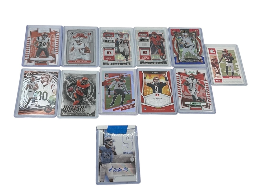 Cincinnati Bengals and Tennessee Titans Football Trading Card Collection (12 Items): This collection features a selection of modern football trading cards, primarily focusing on the Cincinnati Bengals, with highlights including rookie cards and an autographed variation.