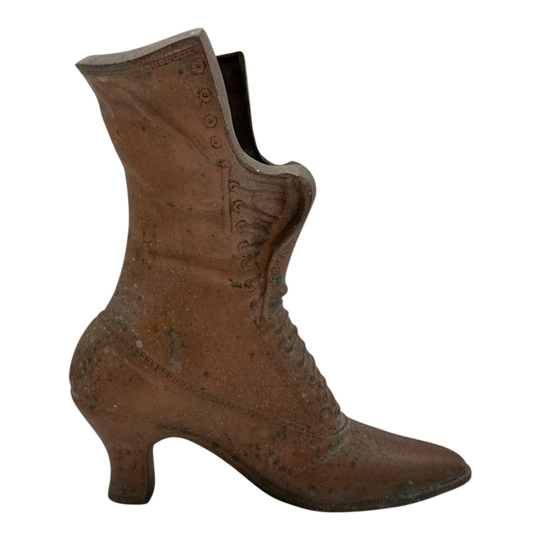 Decorative Metal Shoe Form Vessel with Aged Patina: Unique decorative metal vessel formed as a Victorian-style heeled boot, featuring lace-up detailing and an aged verdigris patina throughout. The open top suggests use as a planter, vase, or whimsical 