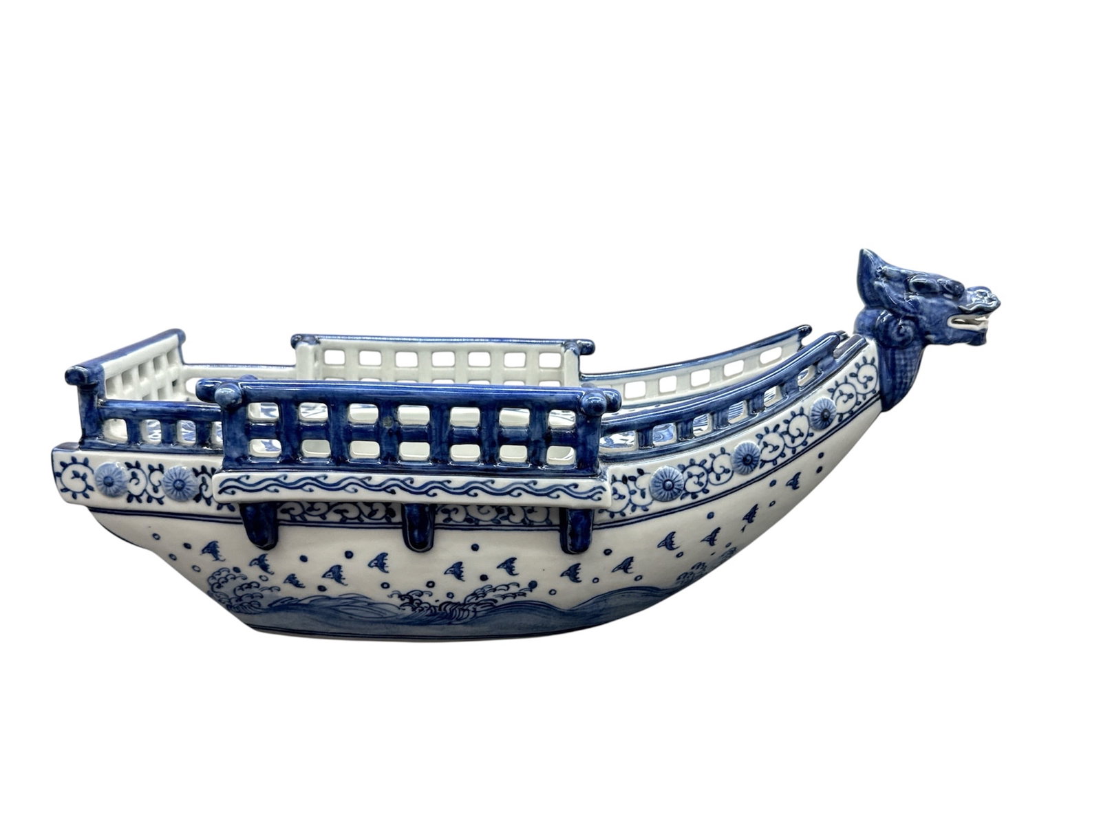 Ornate Chinese Blue and White Porcelain Dragon Boat Figural Censer: This is a finely crafted Chinese blue and white porcelain figural vessel, designed in the form of a traditional dragon boat. The piece features a prominent, highly detailed dragon head prow with an op