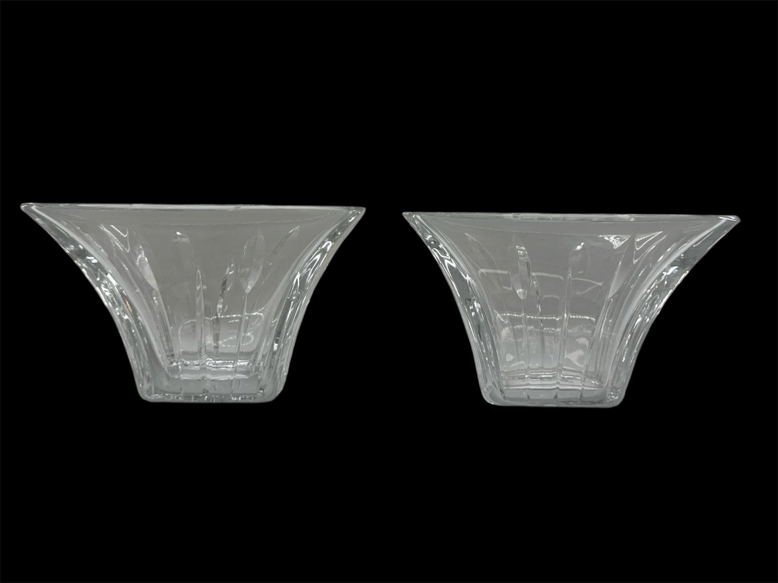 Pair of Clear Art Glass Flared Square Bowls: A pair of clear art glass bowls featuring a flared square form with gently angled sides and a faceted pedestal base. Each bowl displays molded radiating and geometric patterns that enhance light