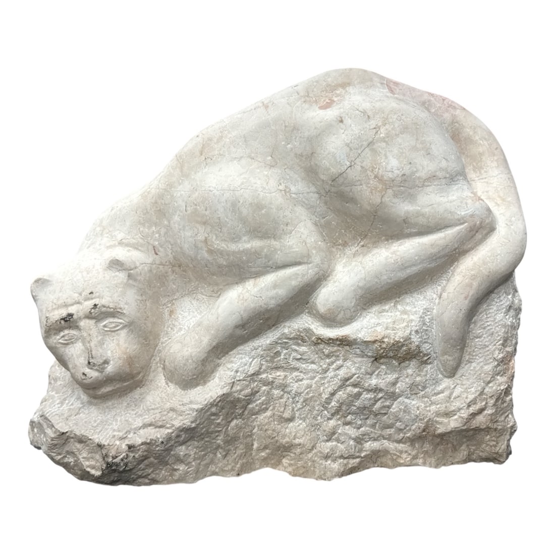 Recumbent Panther by Anthony Padovano (American, B.1933) Carved Stone: This substantial hand-carved stone sculpture depicts a reclining panther or large cat, skillfully integrated into the natural texture of the raw stone base. The artist utilizes a smooth, polished fini