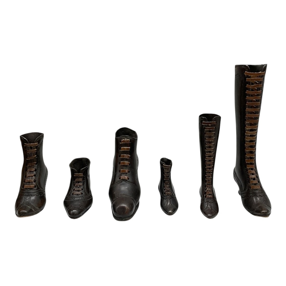 Theodore Alexander Bronze Victorian Boot Figurines, Set of Six: Set of six late 20th-century Theodore Alexander bronze figurines modeled as Victorian boots in a variety of heights and styles. Finely detailed examples featuring leather laces and protective pads