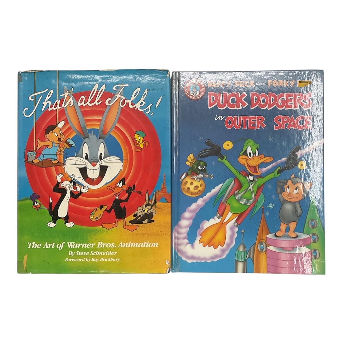 Collection of Two Warner Bros. Animation Books: This collection includes two vintage books celebrating the art and characters of Warner Bros. animation. Featured titles are That's All Folks! The Art of Warner Bros. Animation