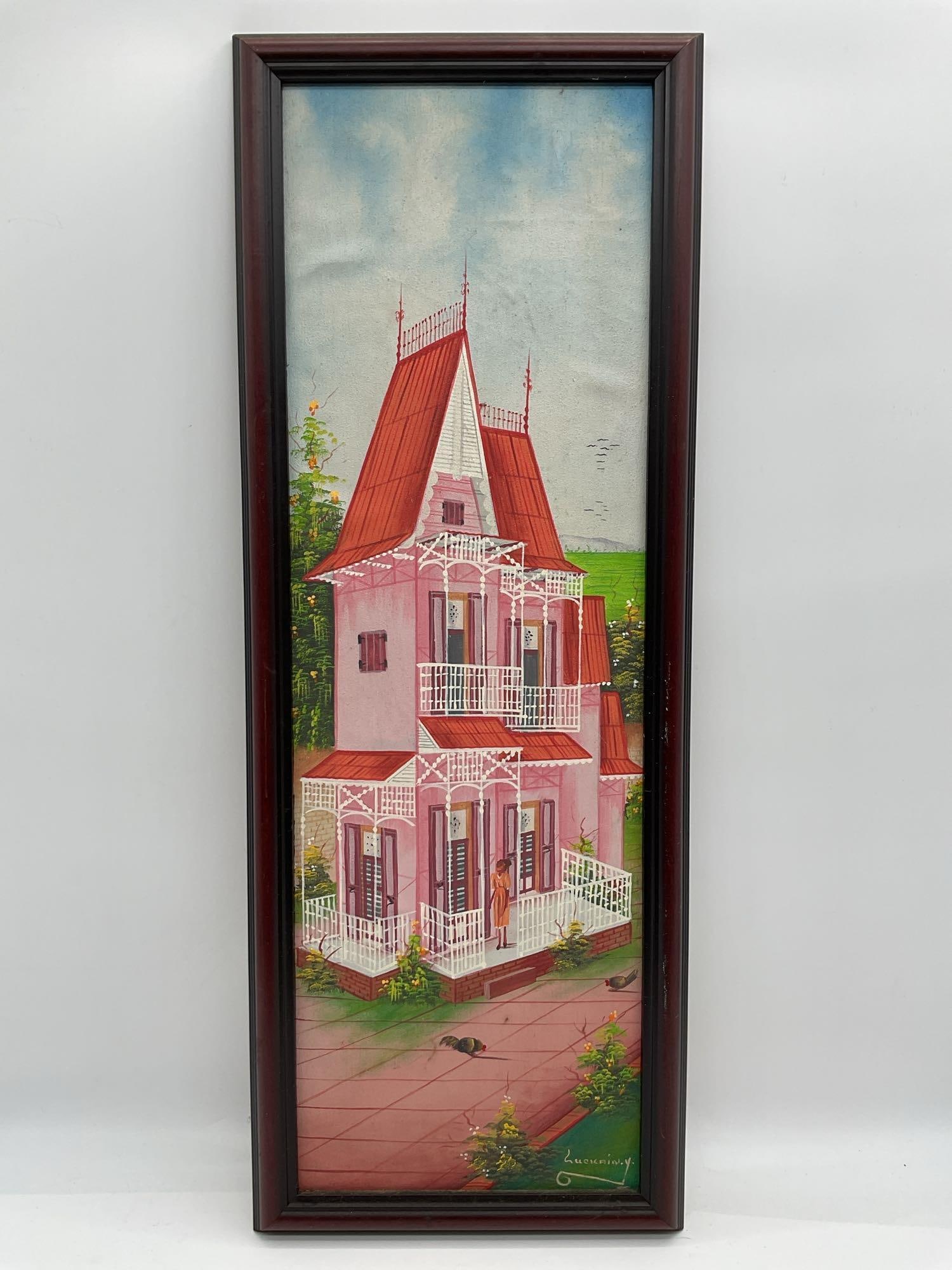 Pink House by Luckrin Y (Haiti) Acrylic on Canvas: Vertical painting of a traditional Haitian-style gingerbread house with red roof and white lattice, signed “Luckrin Y.” Medium: Acrylic on canvas Dimensions: H:32in L:12in