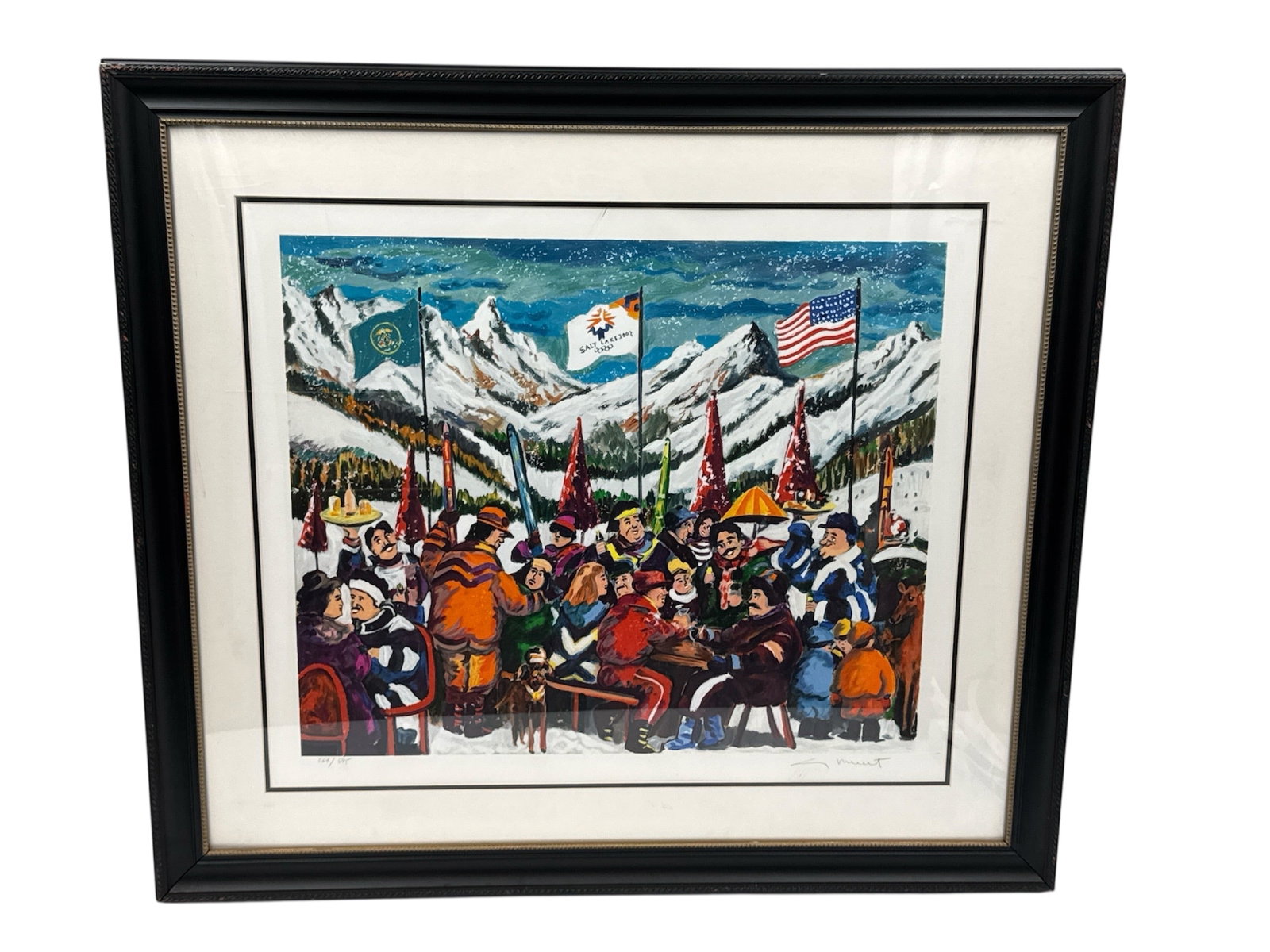 Guy Buffet Salt Lake City Olympic Limited Edition Serigraph Framed 264/595: Limited edition serigraph titled Salt Lake City Olympic by listed French artist Guy Buffet. This vibrant and celebratory winter scene depicts a lively gathering set against snow-covered mountains, wit