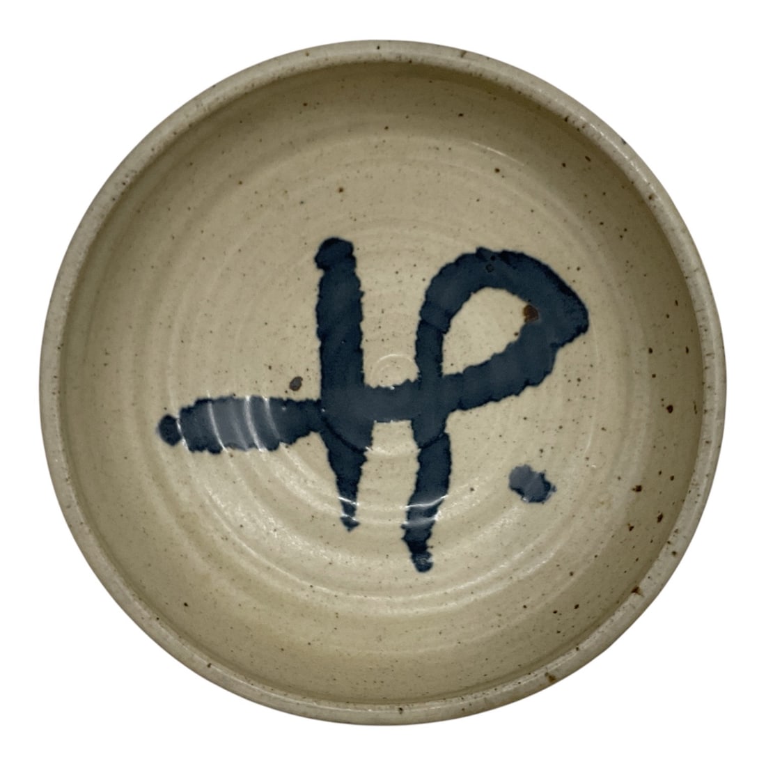 Studio Pottery Bowl in the Japanese Mingei Style: This studio pottery bowl features a warm speckled stoneware body accented by a bold cobalt blue brushwork design. The hand-thrown form and expressive decoration reflect the influence of traditional Ja