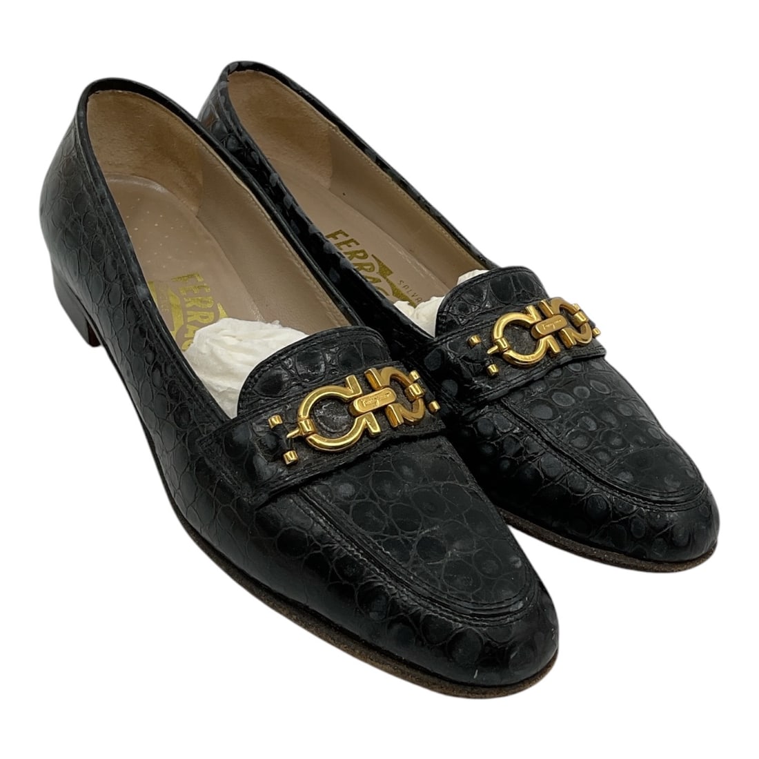 Salvatore Ferragamo Black Monogram Leather Loafers Size 7.5: Pair of Salvatore Ferragamo loafers crafted in black monogram embossed leather featuring gold-tone Gancini hardware across the vamps. Classic low heel silhouette with pointed toes and refined Italian 
