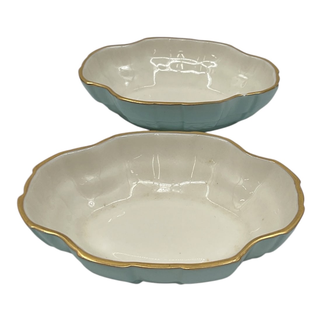 Pair of Lenox Celadon Glazed Porcelain Serving Bowls: Decorative pair of Lenox porcelain serving bowls featuring celadon glazed exteriors with scalloped rims and gilt accents. Includes two matching bowls in complementary sizes with Lenox marks to undersi